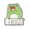 An enamel pin featuring a green frog with an open mouth expression and the text FROGOT.