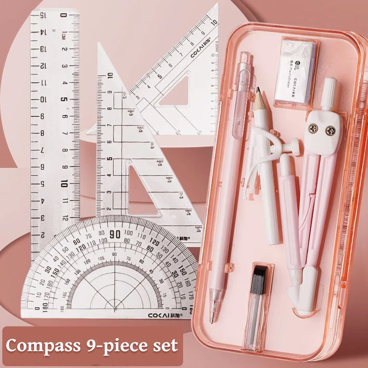 A pink storage case containing a 9-piece compass set with various drawing tools and a ruler.