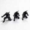 Matte black ninja figurine pen holder in a dynamic pose against a white background