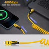 A yellow retractable fast charging cable with a 65W USB-C adapter is shown connecting to a smartphone.