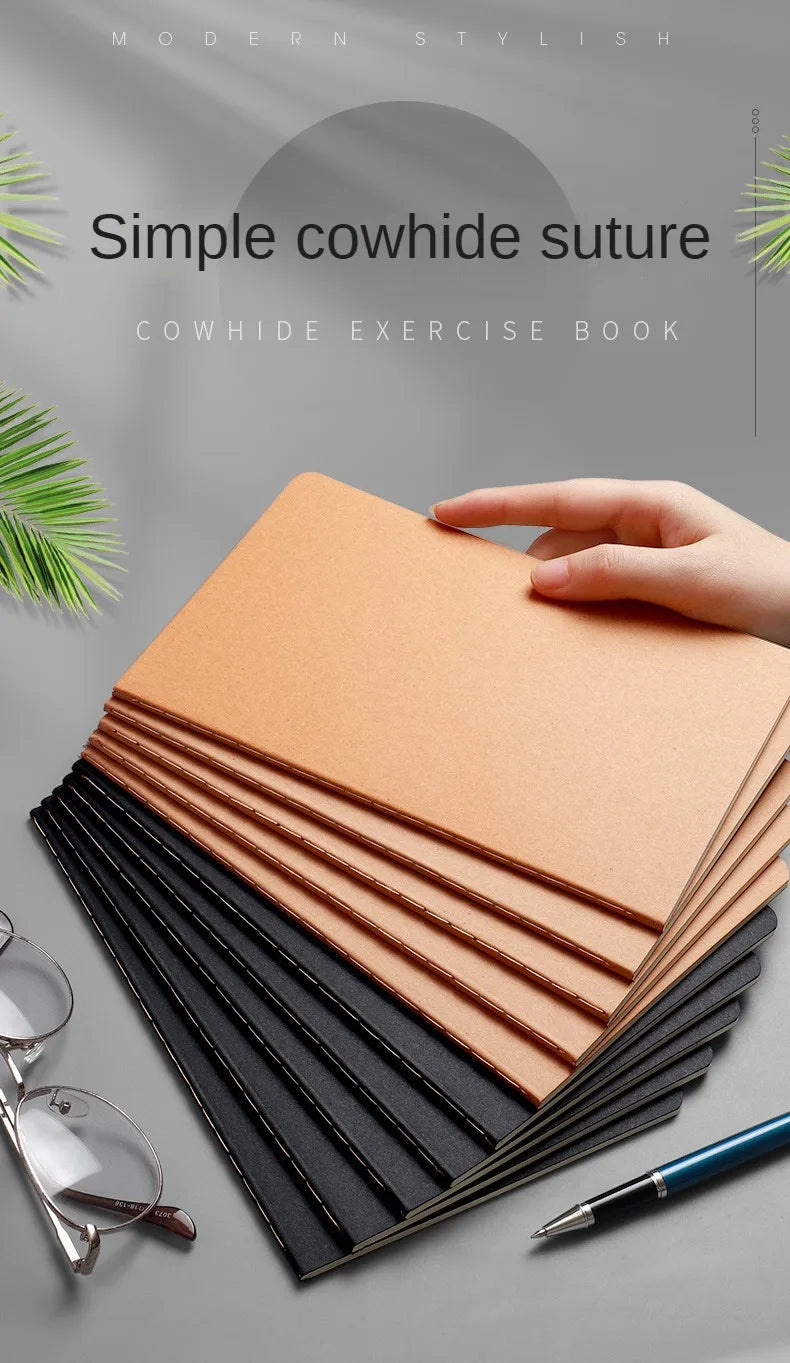 A stack of simple cowhide suture notebooks in shades of tan and black are displayed on a gray surface.