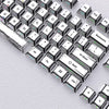 A close-up view of a set of translucent PBT keycaps with side printing in a cherry profile layout.