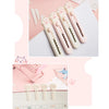 A set of pink and white portable pet claw tools or knives for crafting and decoration, displayed next to a calendar.