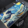 Extra-large mouse pad featuring a detailed illustration of The Great Wave of Kanagawa in blue and yellow tones