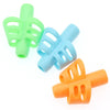 A set of three silicone pencil grips in lime green, light blue, and orange.