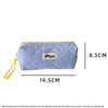 A light blue checkered pencil case with yellow drawstring on the side.