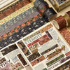 A close-up of a vintage floral washi tape set featuring patterned rolls and an open book with decorative pages.