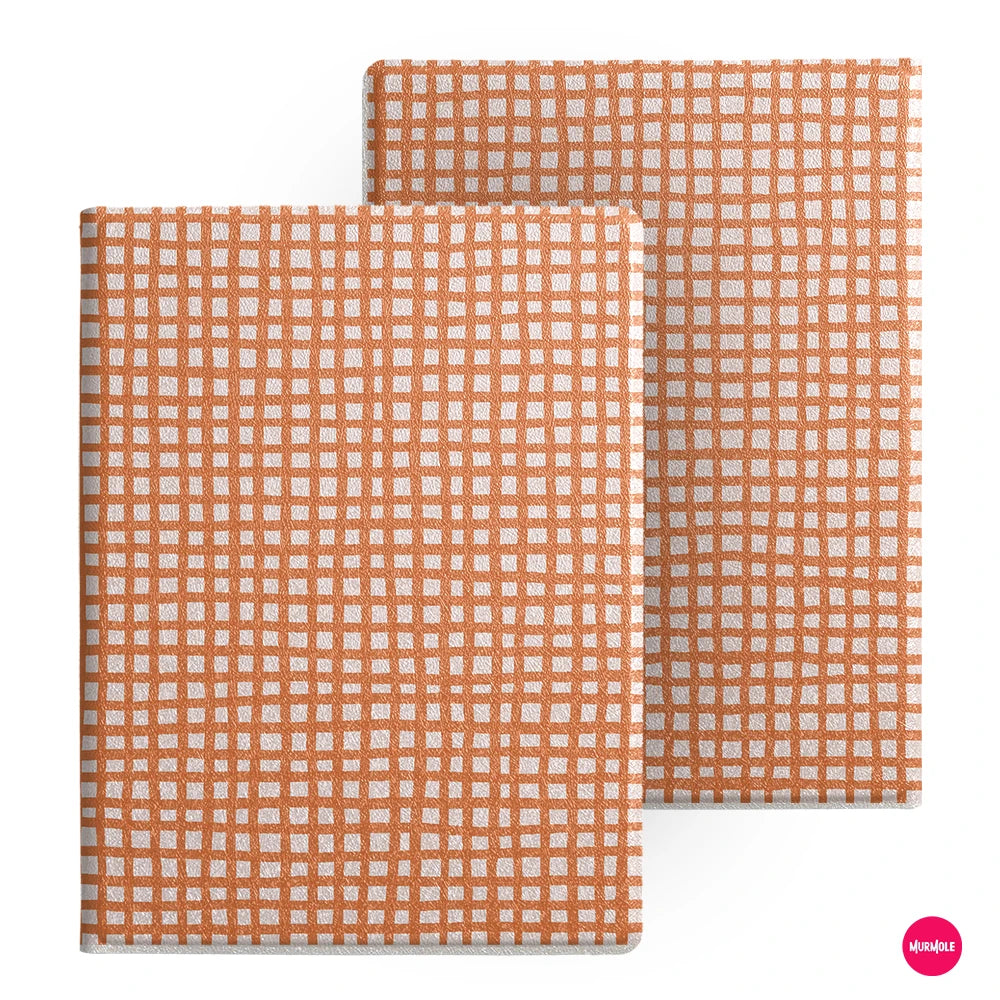 A close-up view of a classic orange and white checkered magnetic folio cover for a Bigme B6 e-reader.