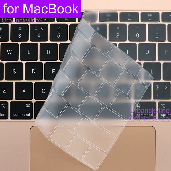 A clear silicone keyboard cover is shown placed on a MacBook keyboard.