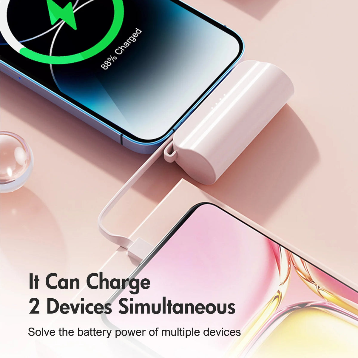 A pink power bank charging a smartphone and another device simultaneously.