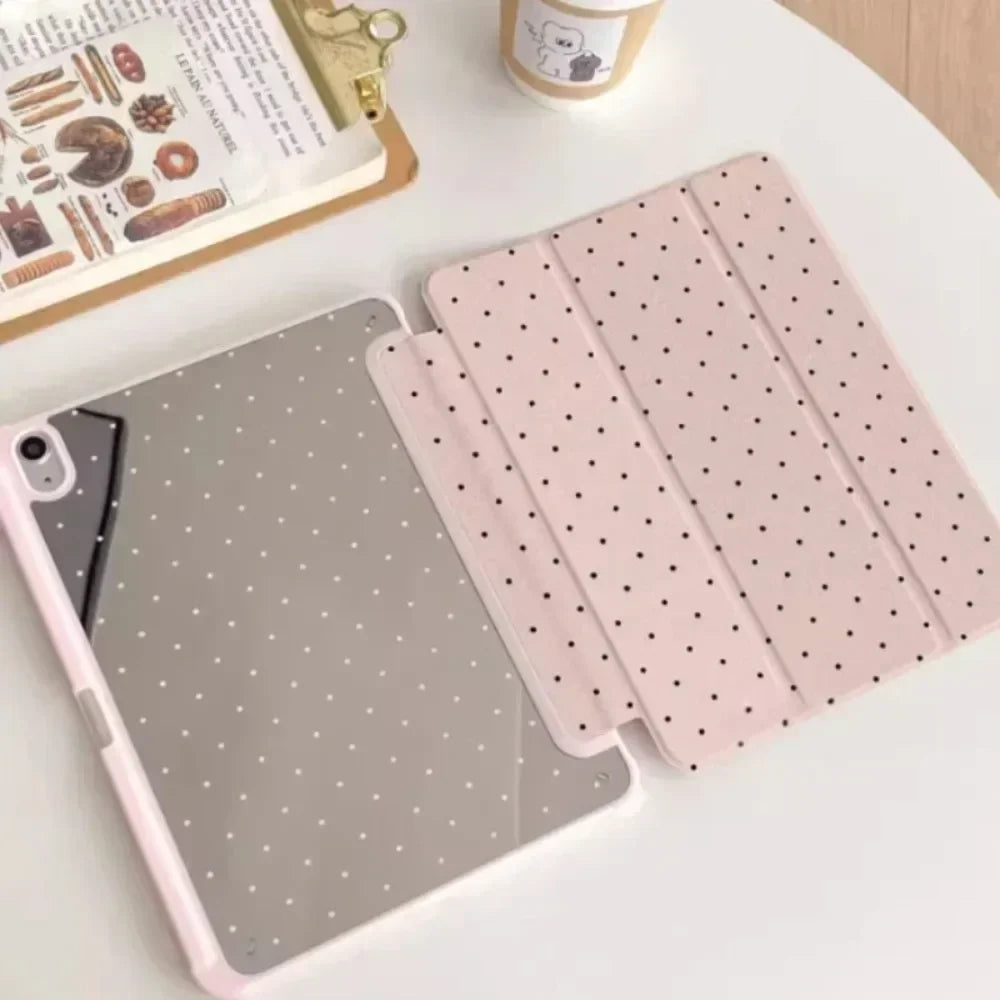 A pink acrylic protective skin designed to fit an iPad case, featuring a grid pattern of small dots.