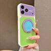 A hand holds a purple and green magnetic ring stand shockproof phone case with camera protection.