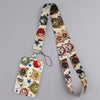 A patterned cat-themed lanyard featuring various cats and stars, attached to a card holder.