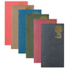 A row of five vertical colored paper inserts with gold foil designs for notebooks and journals.