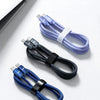 A blue braided nylon USB-C to USB-C fast charging cable is shown next to a laptop.
