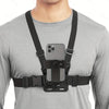 A person wearing a gray shirt has an adjustable phone clip holder with a black chest strap attached to their shirt.