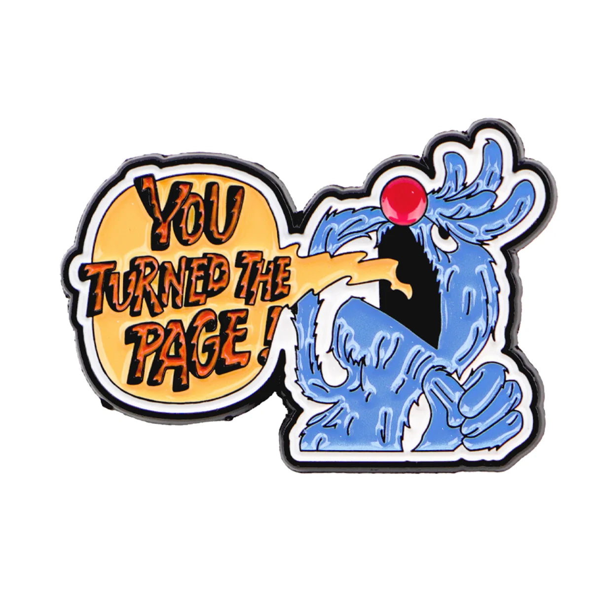 A lapel pin featuring a stylized blue creature with a red eye and text that reads You Turned the Page!