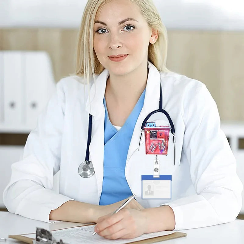 A woman in a white lab coat smiles while holding an anime large intestine badge reel on her uniform.