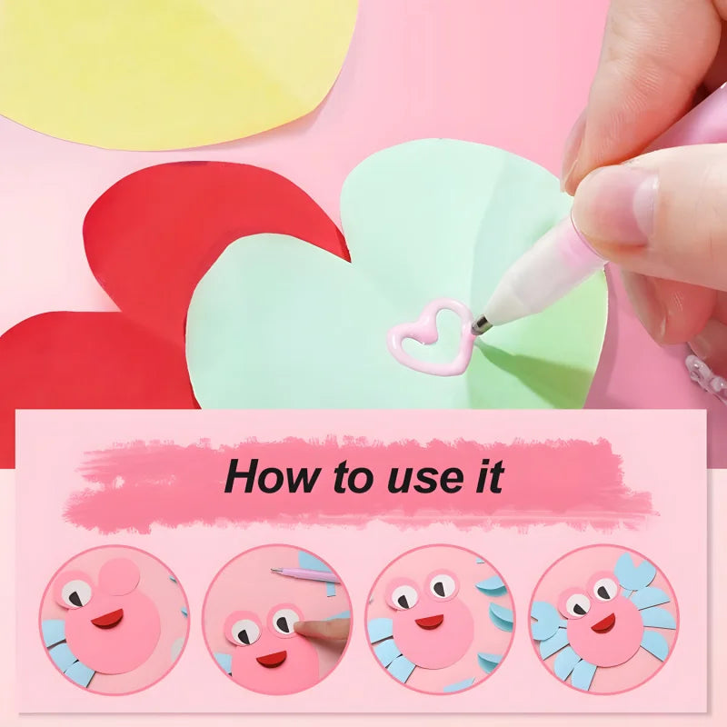 A hand is using a pink glue pen to apply a heart shape onto a light green paper cutout.