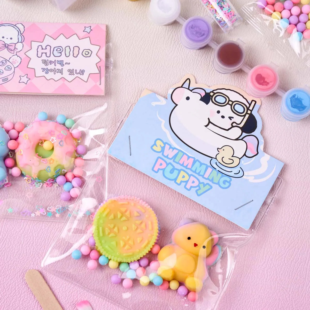 Silikon-Squishy-Maker-Set mit bunten Squishies und einer Karte mit der Aufschrift „Swimming Puppy“