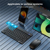 A portable Bluetooth keyboard is shown next to an iPad and a mouse on a dark surface.