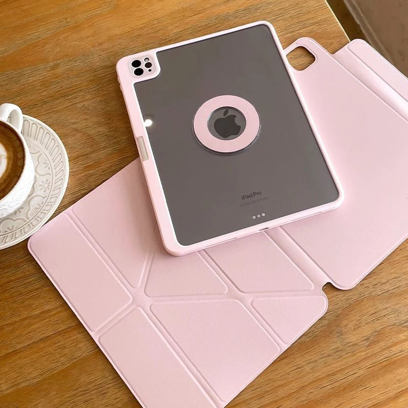 A pink magnetic protective case for an iPad Pro resting on a matching pink pad on a wooden surface.