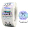 Roll of rainbow laser thank you stickers for gifts and packaging featuring the text Thank you for supporting my small busines
