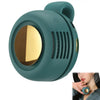 A teal portable mini blade-less electric fan with a circular grille and a gold accent.