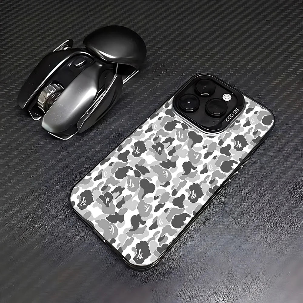 A black matte shockproof case for an iPhone is shown next to the phone and a wireless earbud.