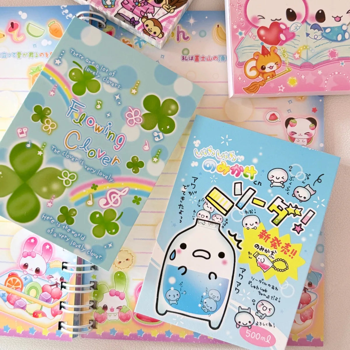 A collection of colorful memo pads featuring cute flower designs and Japanese text