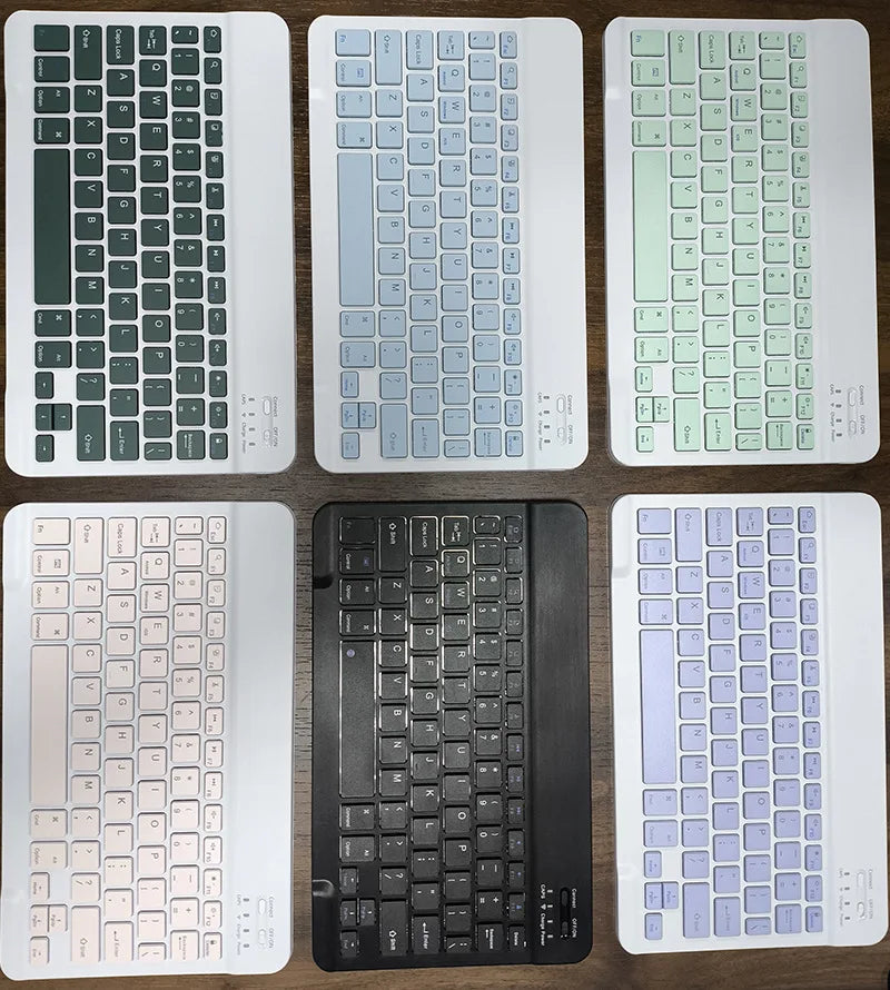 A collection of various magnetic keyboard cases for an iPad Pro, shown in different colors and styles.