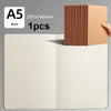 A5 blank kraft cover notebook with ribbed texture shown next to the open pages