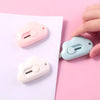 Two portable utility knives in pink and light blue are shown against a white background.