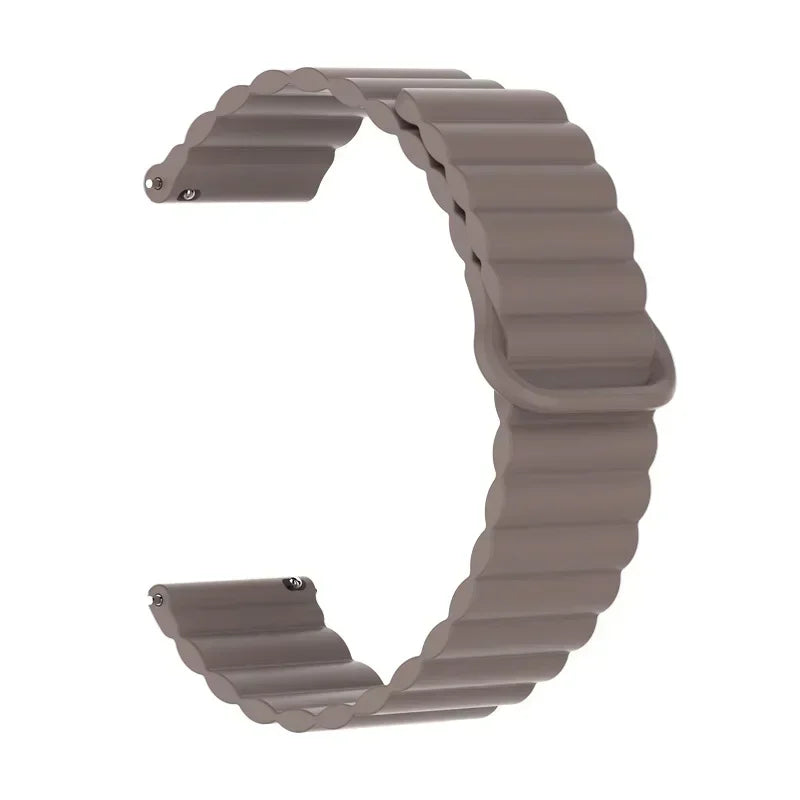 A gray adjustable magnetic loop watch band shown in a curved shape.
