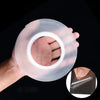 A hand holds a roll of clear double-sided gap tape, showing the transparent plastic material.