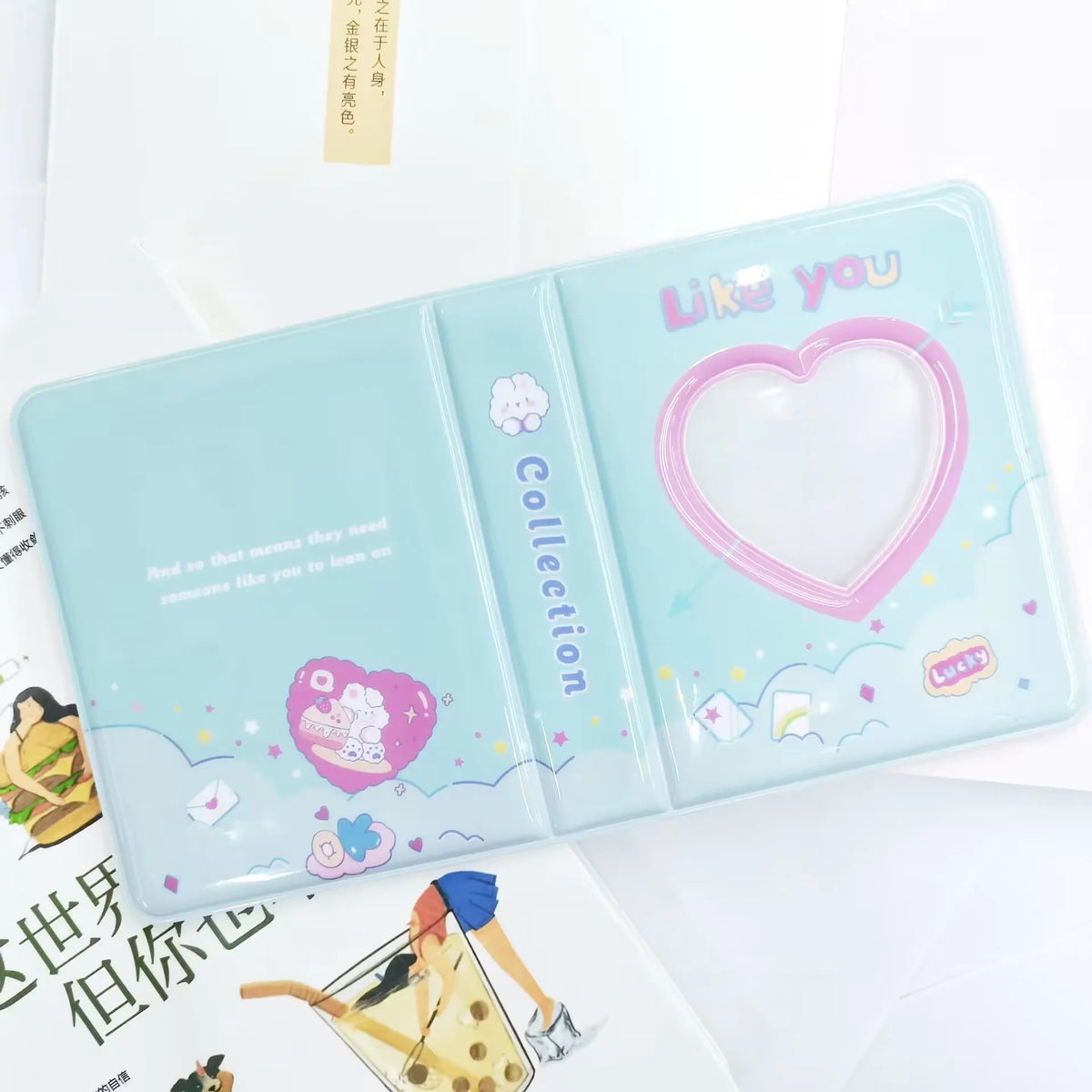 A clear blue photo card binder with a pink heart design and the text Like You