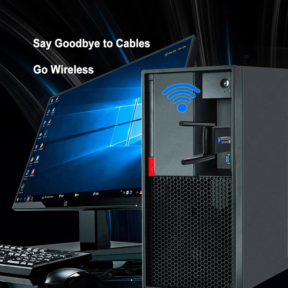 A black computer tower with a mounted Wi-Fi adapter showing a wireless signal icon, next to a monitor and keyboard.