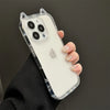 A hand holds a clear silicone case with cat ears on an iPhone, featuring shockproof protection.
