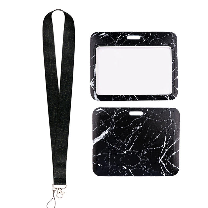 Black marble-patterned key lanyard with a rectangular ID badge holder.