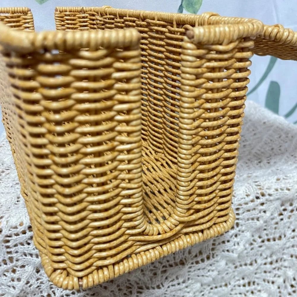 Handwoven rattan cable management box with a lid in natural tan color