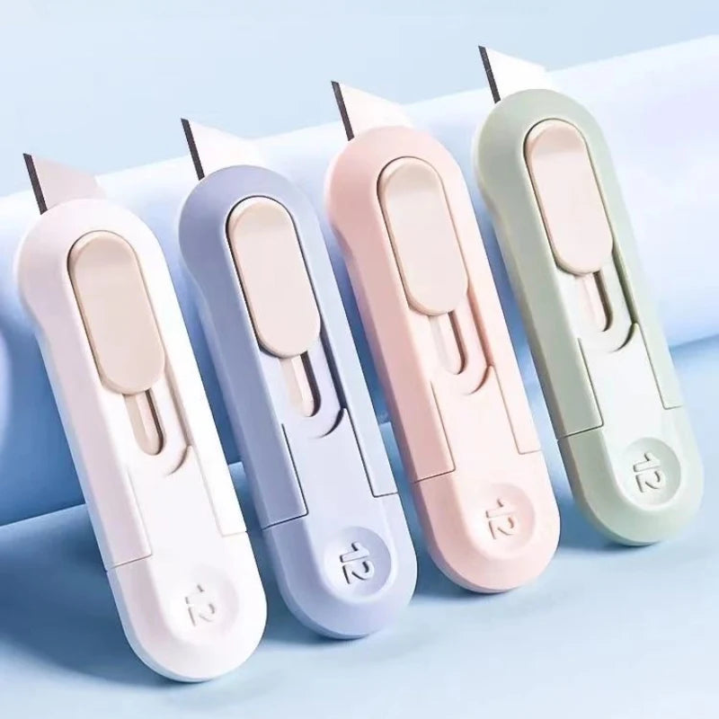 A set of five compact mini paper cutters in various pastel colors, including pink, lavender, and mint green.