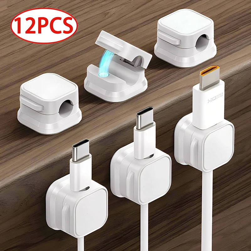Twelve magnetic cable clips in white and black are shown for desk organization.