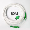 A coil of 80 meters of white single-mode fiber optic cable with green connectors.