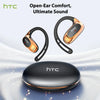 A pair of gold and black open-ear headphones resting above a black charging case.