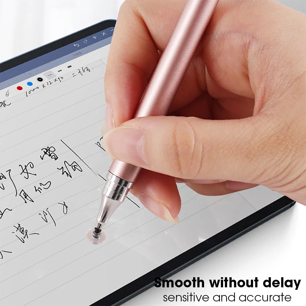 A hand holds a rose gold dual-tip capacitive stylus pen writing on a digital tablet screen.