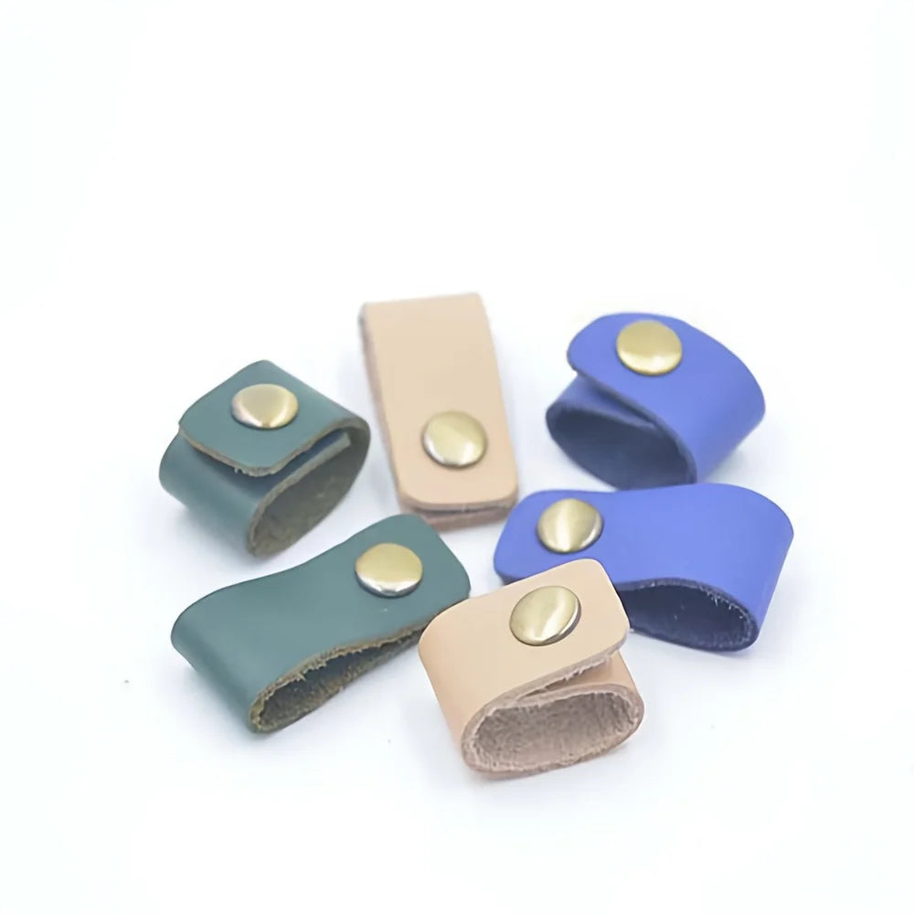 A collection of ten faux leather data cable earphones in various shades of blue and beige.
