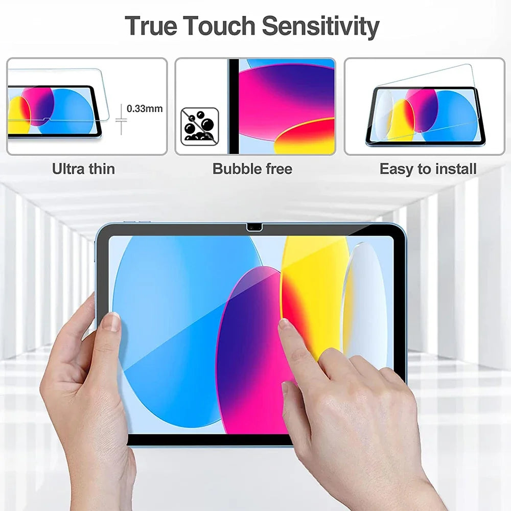 A hand is touching a tablet screen protected by a clear dual tempered glass screen protector.