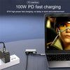 A laptop is shown connected to a 100W PD fast charging dock and cable for power delivery.
