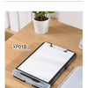 A black portable board clip file box with a white writing surface is shown on a wooden table.
