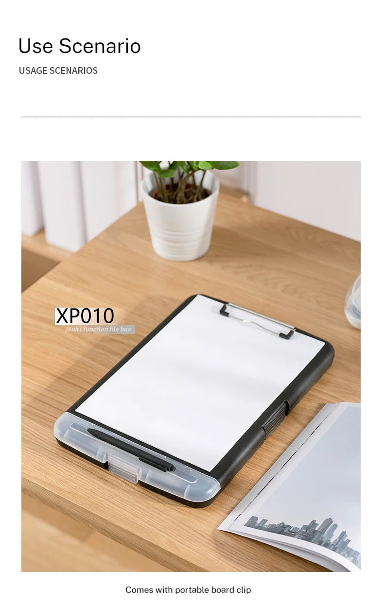 A black portable board clip file box with a white writing surface is shown on a wooden table.